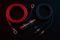 Subwoofer wiring kit with fewer components. Dark background, red/blue highlights, performance aesthetic.